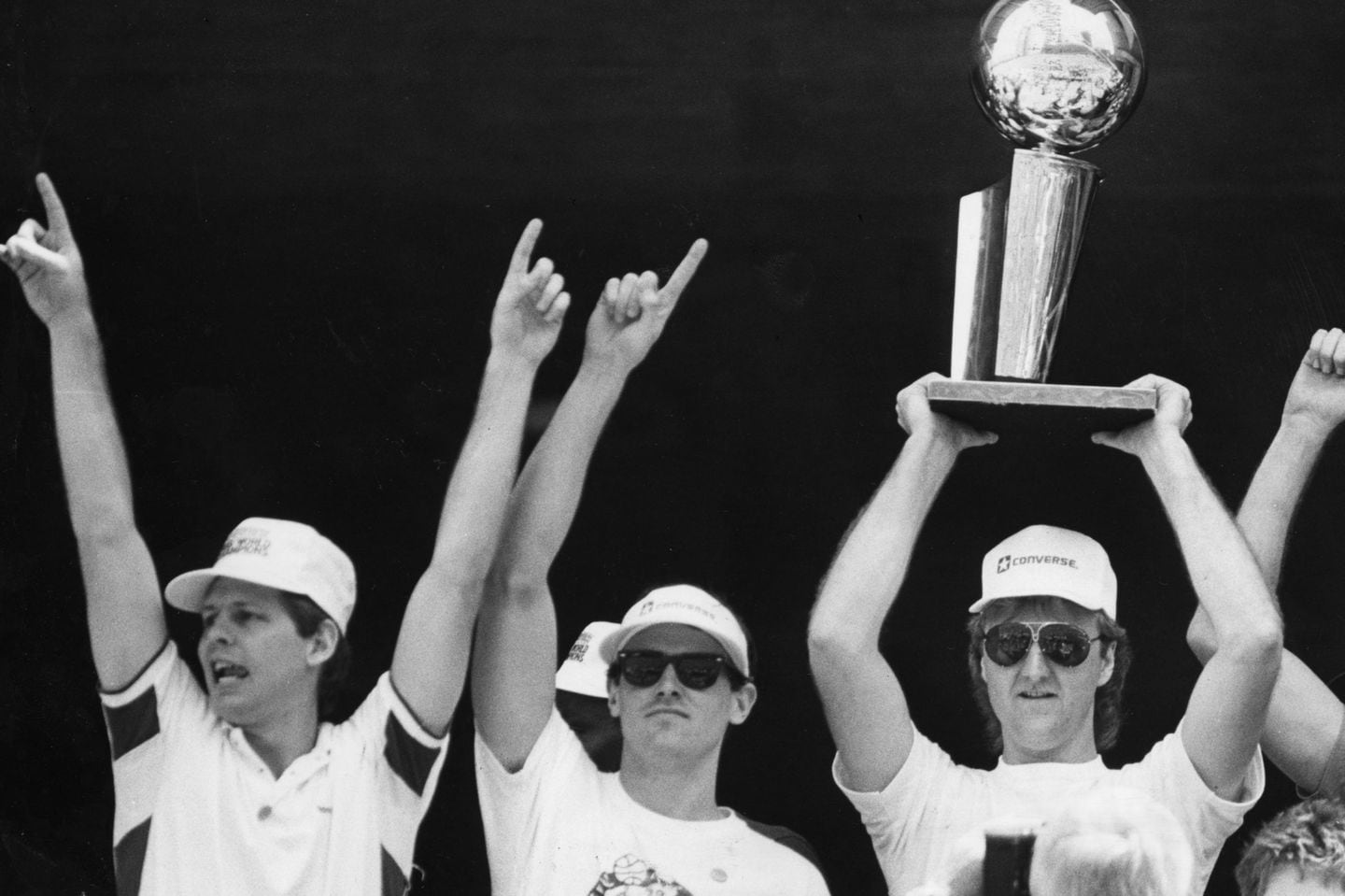 Rick Carlisle (center) was flanked by Danny Ainge (left) and Larry Bird (right) at a City Hall Plaza celebration honoring the 1986 champion Celtics.