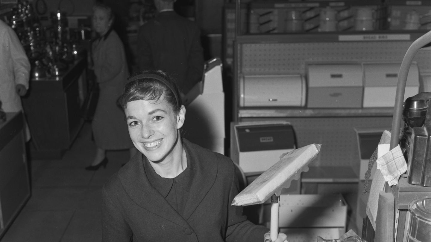 British artist (later novelist) Shirley Conran holding a mop at Selfridges department store in London, May 24, 1957.