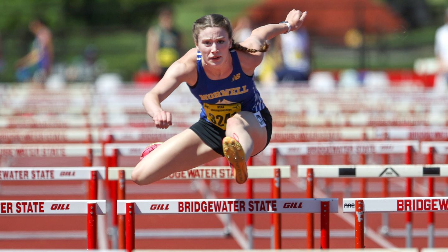 Norwell senior Liliana MacDonald soars in the 100-meter hurdle race during the girls' pentathlon competition on Day 1 of the Division 5 state meet at Bridgewater State College.