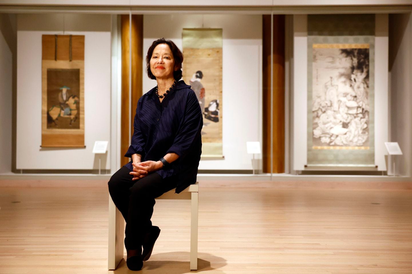 Anne Nishimura Morse, the William and Helen Pounds Senior Curator of Japanese Art, sits for a portrait in one of the newly renovated galleries at the Museum of Fine Arts, Boston.