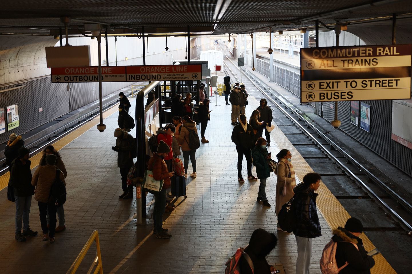 Boston, MA—12/14/2022 - Commuters wait for the T to arrive at Ruggles Station. (Jessica Rinaldi/Globe Staff) 
