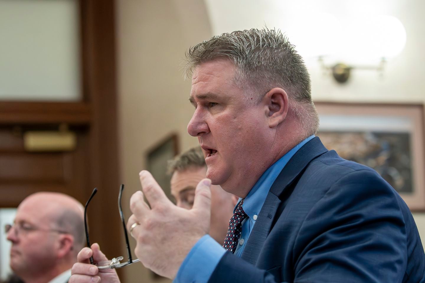 Maine State Police Colonel William Ross answered questions from the Independent Commission to Investigate the Facts of the Tragedy in Lewiston during a hearing at Lewiston City Hall.